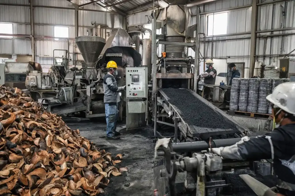 Production process showing how coconut charcoal briquettes are made in factory facility