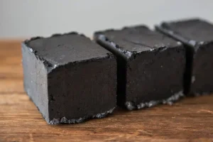 Naturally processed briquettes made from coconut shell biomass with dense texture and clean surface